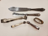 Silverplate grouping including WMF, knives, sugar and ice tongs