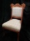 Victorian ornately carved wooden parlor chair