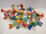 LARGE GROUP OF VINTAGE PEZ DISPENSERS WITH CANDIES, IN PACKAGE, MOSTLY ALL HAS SEALED