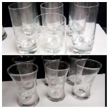 CLEAR GLASS INCLUDING THREE PAIRS OF MATCHING ETCHED FIGURES, AND UNTIPABLE CYLINDER GLASSES