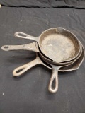 Stack of petite Vtg Cast Iron Skillets including WAGNER #3