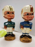 PAIR OF VINTAGE SPORTS SPECIALTIES NEW YORK JETS AND MIAMI DOLPHINS BOBBLEHEADS