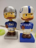 PAIR OF VINTAGE SPORTS JAPAN BOBBLEHEADS: COLTS and LIONS