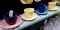 (8) PC FIESTA MUGS AND SAUCERS MULTI COLORED pink, purple, yellow, teal/turquoise, lapis