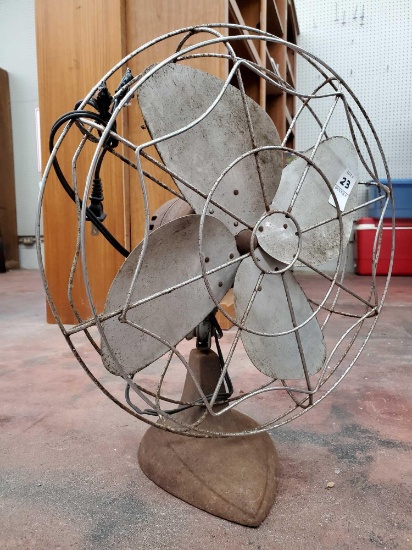 Antique electric fan with cast iron base, spider web cage