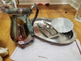 Collection of silver plate and stainless serving pieces including pitcher