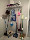 GROUPING OF LAUNDRY ROOM/CLEANING TOOLS - DUSTBUSTER - IRON - BROOMS/DUSTERS/SWIFFERS