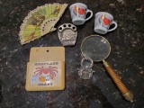 Unique Treasures including brass magnifying glass, souvenirs, I Love Lucy Cups