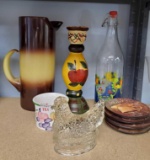 VARIOUS TYPES OF CERAMIC AND GLASS GROUPING INCLUDING HAND ON A NEST AND LARGE CHOCOLATE AND CANARY
