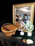 Decor grouping with lovely golden tone mirror, beveled edge, and LED