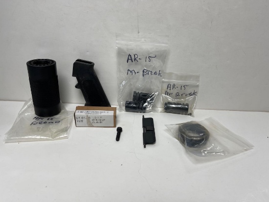 GROUP OF AR-15 PARTS INCLUDING MUZZLE BRAKES, GRIPS, RING ASSEMBLY