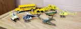 Vintage metal toys including helicopters, bus, planes, earthmovers