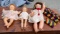 THREE VINTAGE DOLLS, UNEEDA, including crocheted wrap, bonnet and zipper pouch bag
