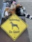 Bin of Dog Toys and Metal Doberman On Guard sign.