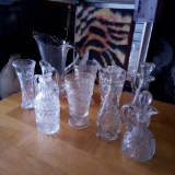 GROUPING OF VINTAGE GLASS VESSELS INCLUDING CRUETS, PITCHER WITH INTERESTING STARBURST BASE, RARE