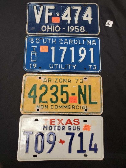 4 vintage license plates including Ohio, South Carolina, Arizona, Texas motorbus