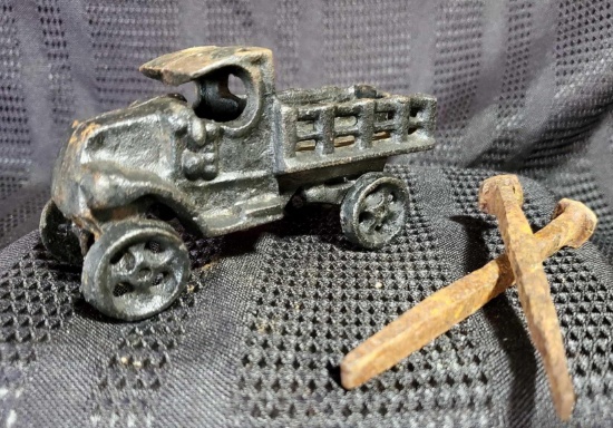 CAST IRON TRUCK AND STAKES