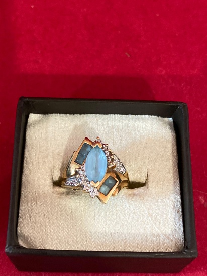 10k gold ring with pale blue stones and diamond chips