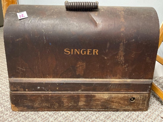 VINTAGE SINGER PORTABLE SEWING MACHINE. UNOPENED, NO KEY HEAVY. UNKNOWN MODEL INSIDE