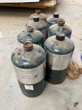 Lot of 7 small propane bottles
