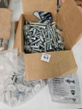 Box of bolts and brand new furniture leveling bolts
