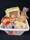 basket full of vintage doll memories including Cabbage Patch Kids, Kewpie Babies Doll, and Teddy