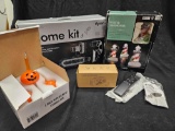 Grouping of boxed items, including Dyson, Samsung remote, Halloween and Christmas novelty lights.