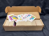 Box of Skybox basketball and NFL pro football cards.