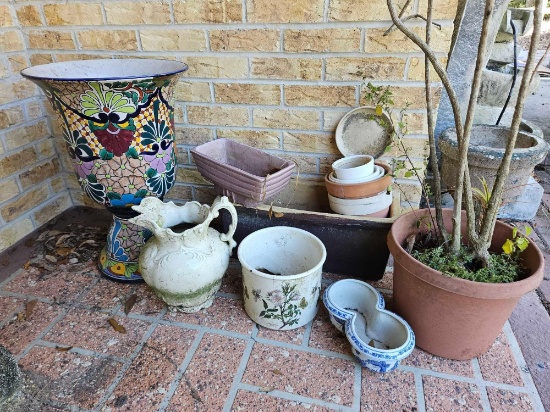 Group of terra cotta plastic and other planters including large Mexican style with broken base