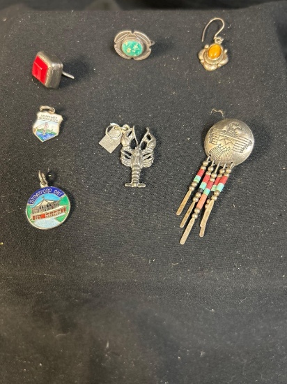 Grouping of souvenir pendants and earrings including silver