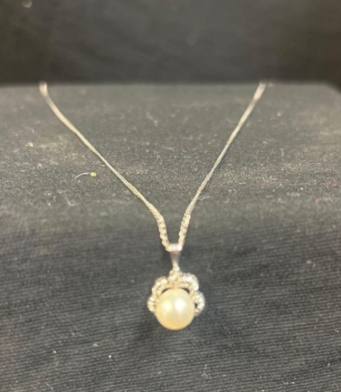 Pearl pendant on chain marked 14k