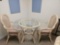 RATTAN AND GLASS TOP DINETTE SET WITH 4 CHAIRS
