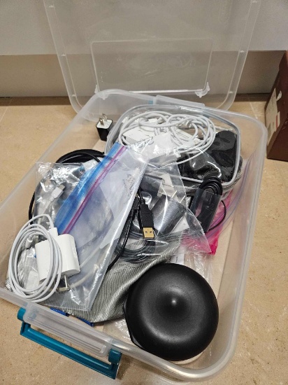 Tote container full of charger cords, earphones, more