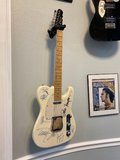 Electric guitar autographed by multiple stars including Peter Frampton, James Young and more