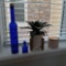 Small Group of Decor including Cobalt Blue Bottles and Candle