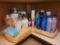 Bottom shelf - beauty products including hair care,
