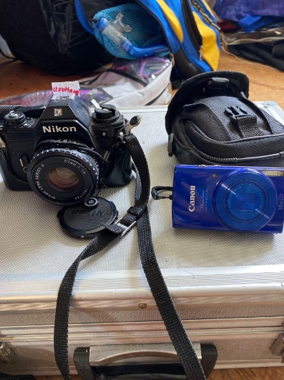 Nikon EM film camera and Canon digital camera
