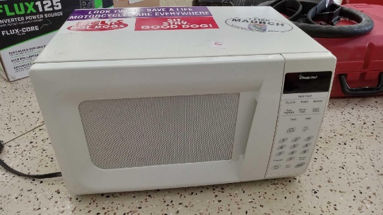 very mini Magic Chef countertop microwave oven