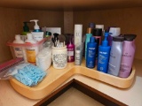 Bottom shelf - beauty products including hair care,