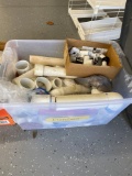 Tote full of fittings and plumbing supplies