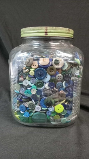 Glass jar filled with a collection of vintage buttons