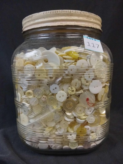 Jar filled with Assorted Vintage buttons, likely materials such as bone, glass, and mother of pearl