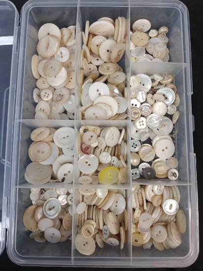 Collection of Vintage mother-of-pearl (or shell) buttons in a Clear container