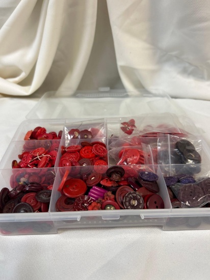 Red-tone Vintage Button Collection in Clear Section Containers, Varying Shapes and Sizes