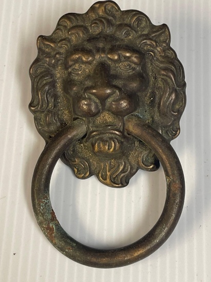 Old 3.5 in. brass lion head drawer pull