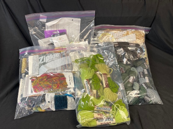 Craft supplies, primarily various types of yarn and possibly other needlework materials