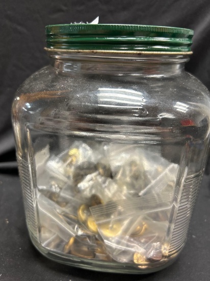 Vintage glass storage jar, commonly referred to as a "Hoosier style with Lots of Gold-tone Buttons