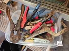 Tote of various wrenches and grips