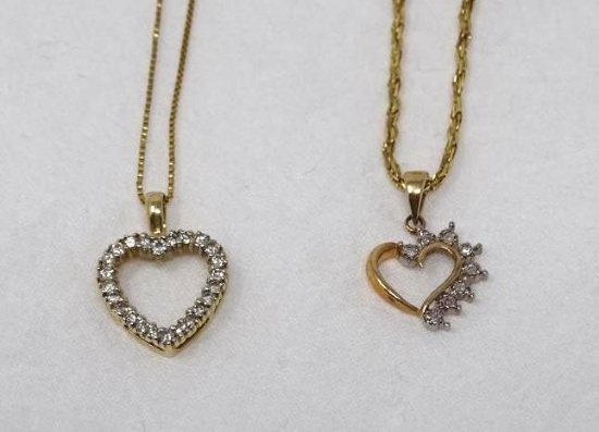 Two gold heart pendants on chains