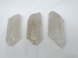 Three clear quartz crystals